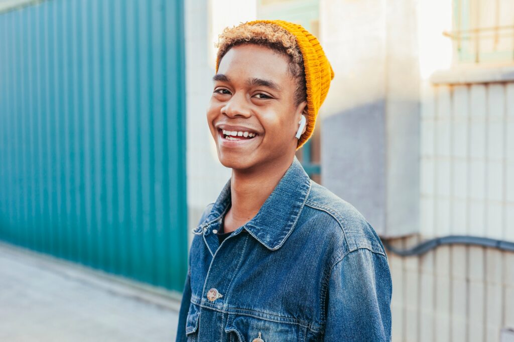 smiling teenage boy outside